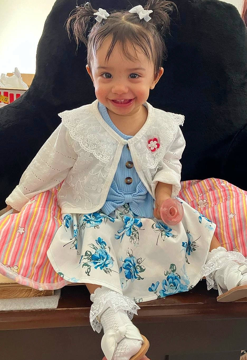 Maya joined the competition — help win amazing prizes! baby, baby_toddler_clothing, cheek, child, comfort, dress, fashion_accessory, formal_wear, fun, hair, happy, joy, pattern, person, pink, product, sitting, skin, sleeve, smile