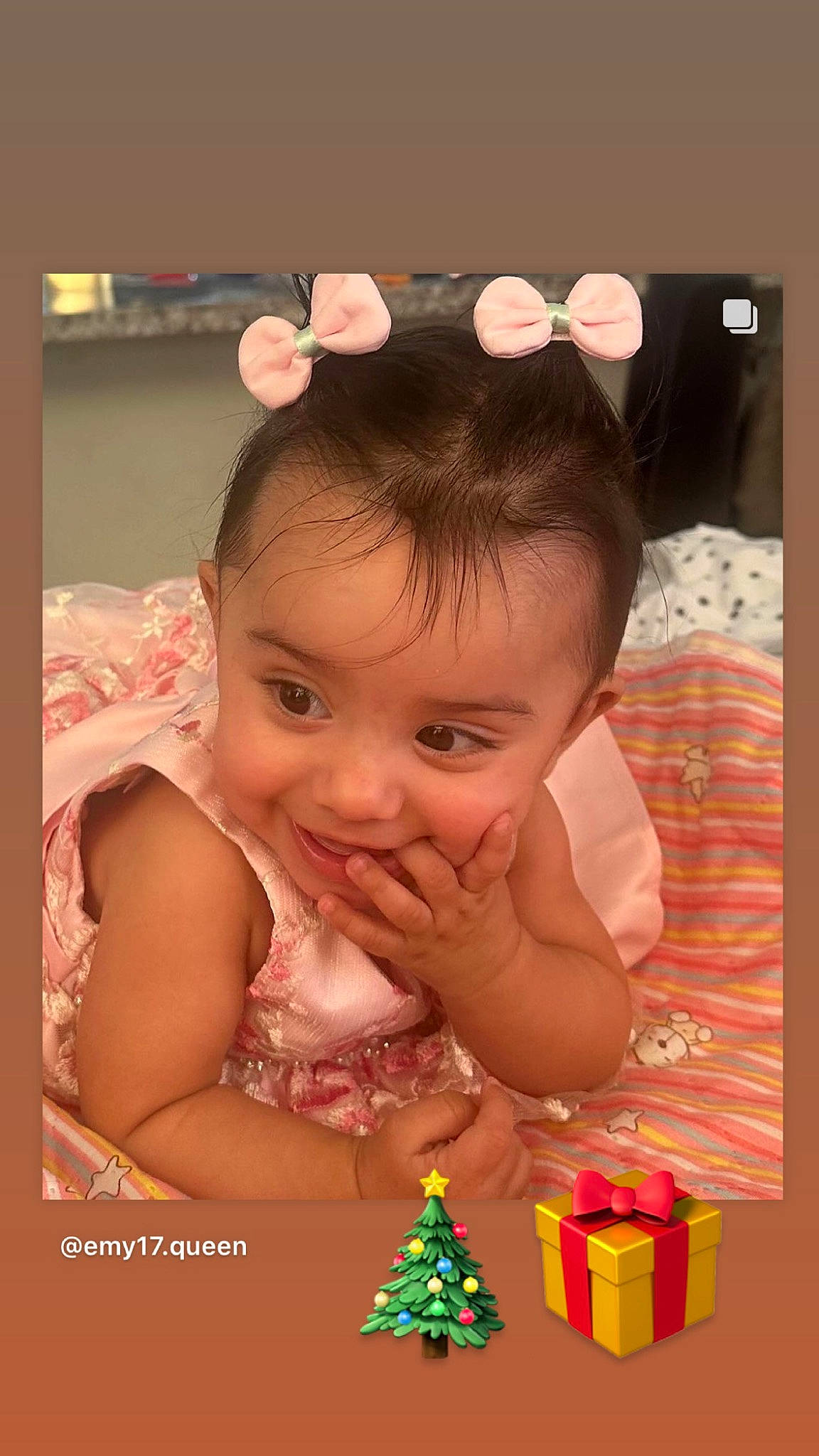 Maya is registered to the contest to win money with this photo: baby, baby_toddler_clothing, cheek, child, christmas_decoration, christmas_ornament, event, eyelash, fashion_accessory, fun, hair_accessory, happy, headband, headpiece, holiday, jewellery, person, smile, sweetness, toddler