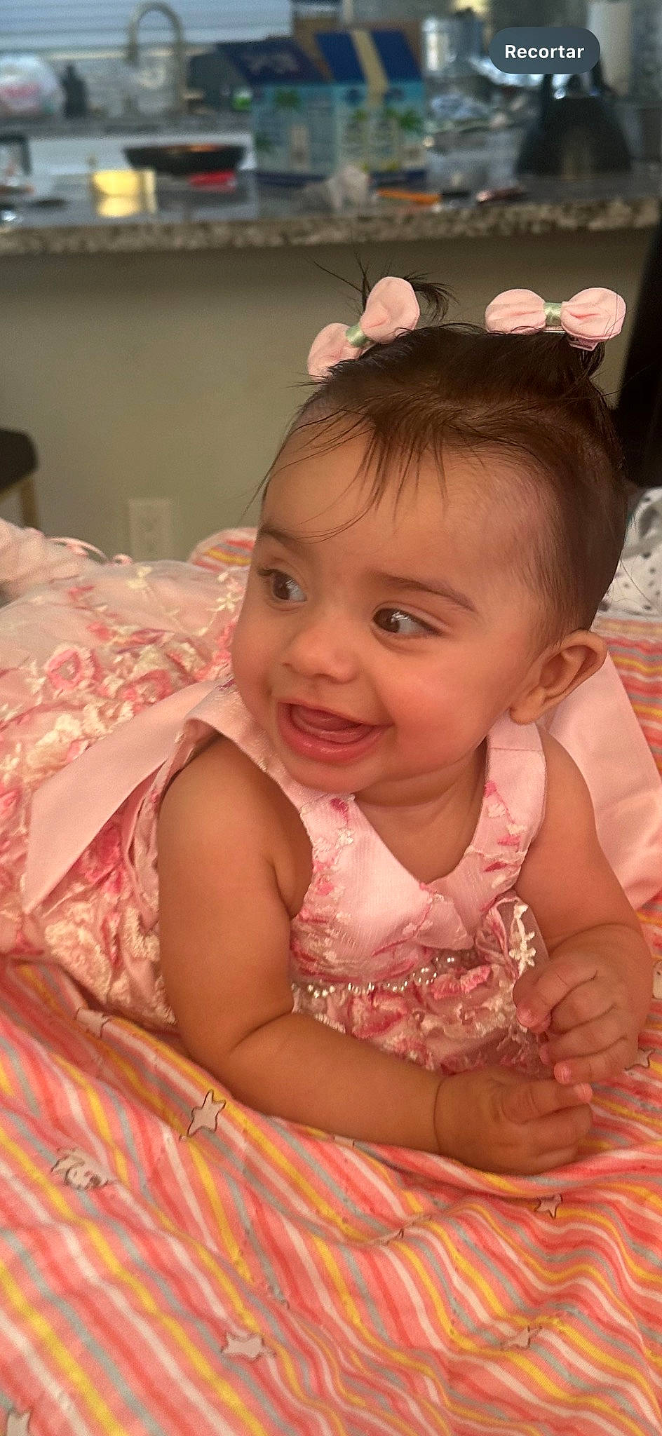 Maya is registered to the contest to win money with this photo: baby, baby_toddler_clothing, cheek, child, chin, dress, embellishment, event, eye, eyelash, face, fun, happy, headpiece, iris, joy, linens, person, pink, skin