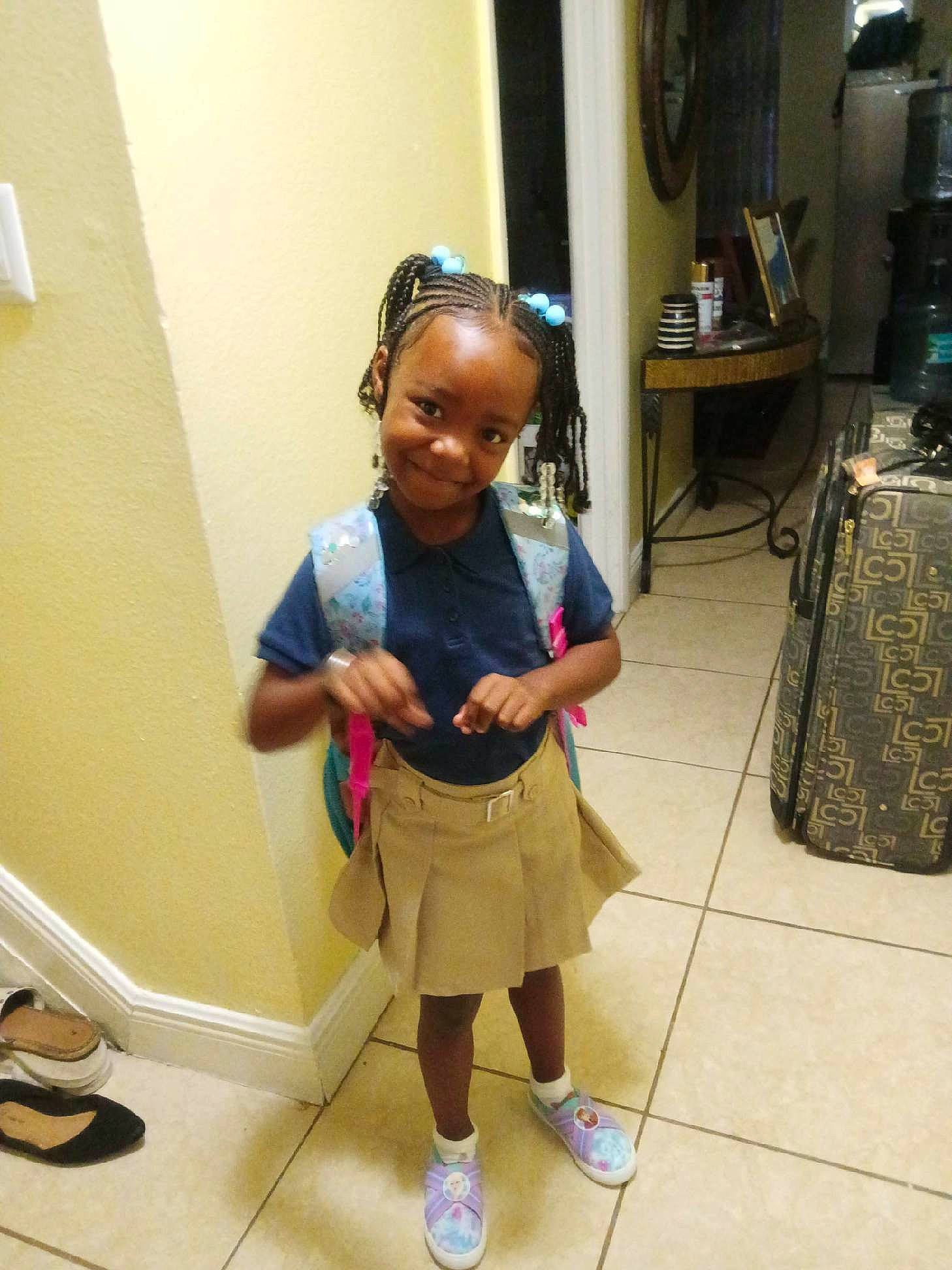 Antonia Amarriana Gwyn joined the competition — help win amazing prizes! baby_toddler_clothing, bag, child, eyewear, floor, flooring, fun, human_leg, joy, knee, luggage_and_bags, person, room, shoe, shorts, sleeve, smile, sneakers, sock, thigh