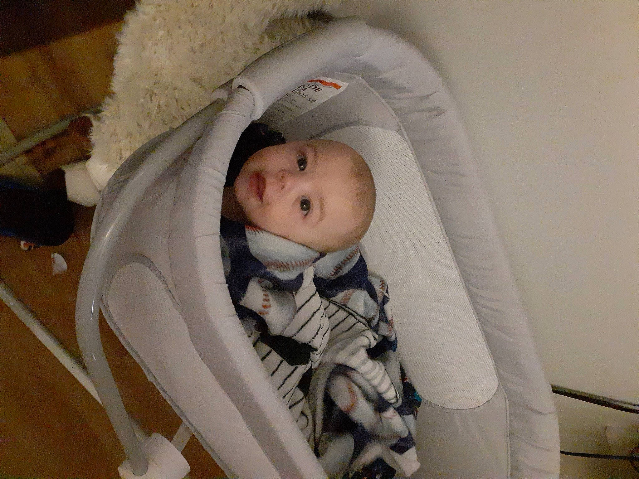 Callum is registered to the contest to win money with this photo: baby, baby_carriage, baby_products, baby_safety, baby_sleeping, baby_toddler_clothing, cheek, child, comfort, eye, hand, head, human_body, infant_bed, iris, mouth, person, product, skin, toddler