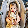 baby, infant, blanket, baby_seat, cushion, feet, hand, face, blue_eyes, hair, indoor, child, comfort, playful, soft_texture, home, seated, cute, looking_up, expression