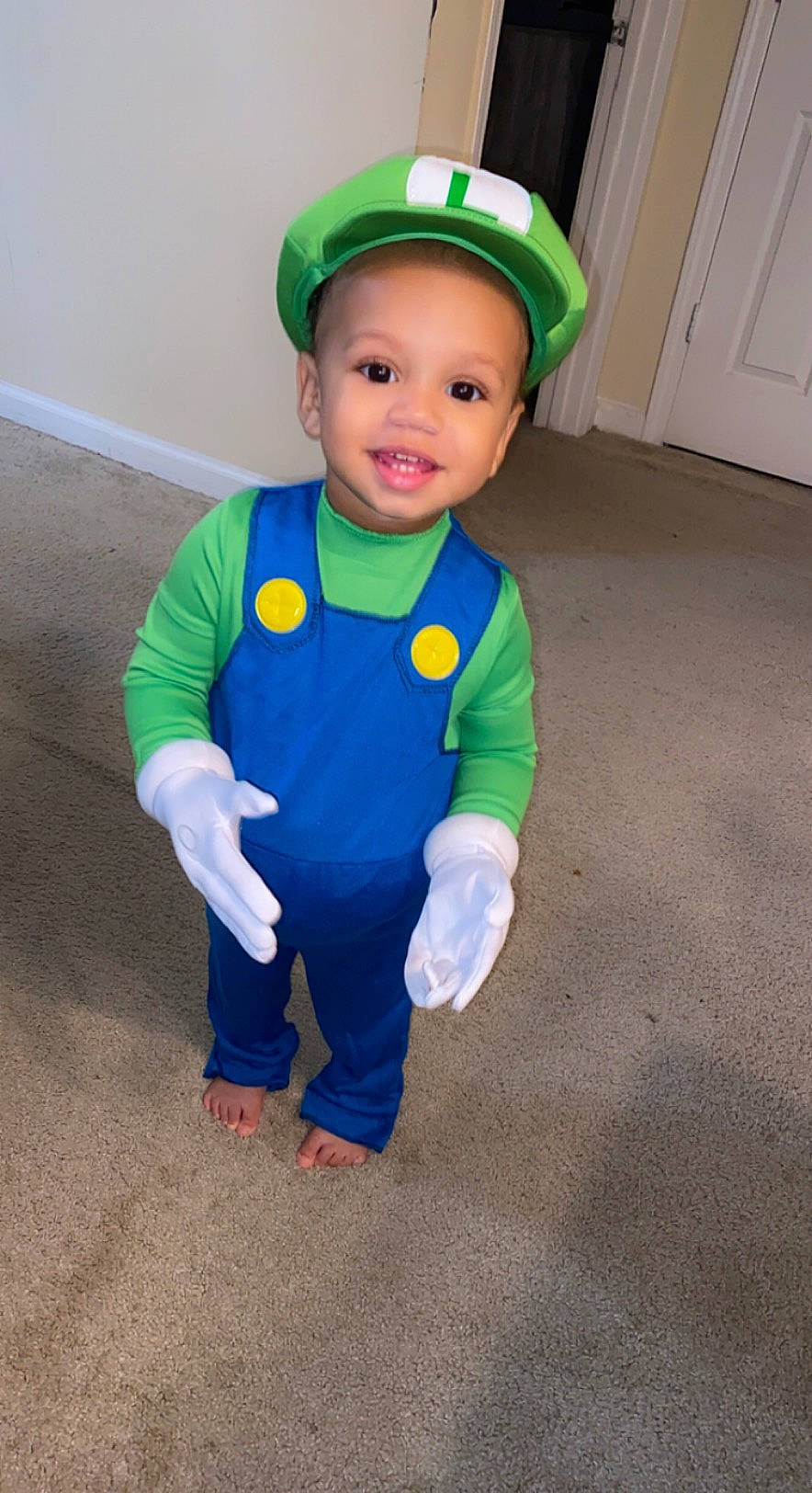 Roman is registered to the contest to win money with this photo: baby, baby_toddler_clothing, baseball_cap, cap, costume_hat, door, electric_blue, eye, face, fashion_accessory, grass, happy, head, headgear, helmet, joy, person, personal_protective_equipment, sleeve, smile