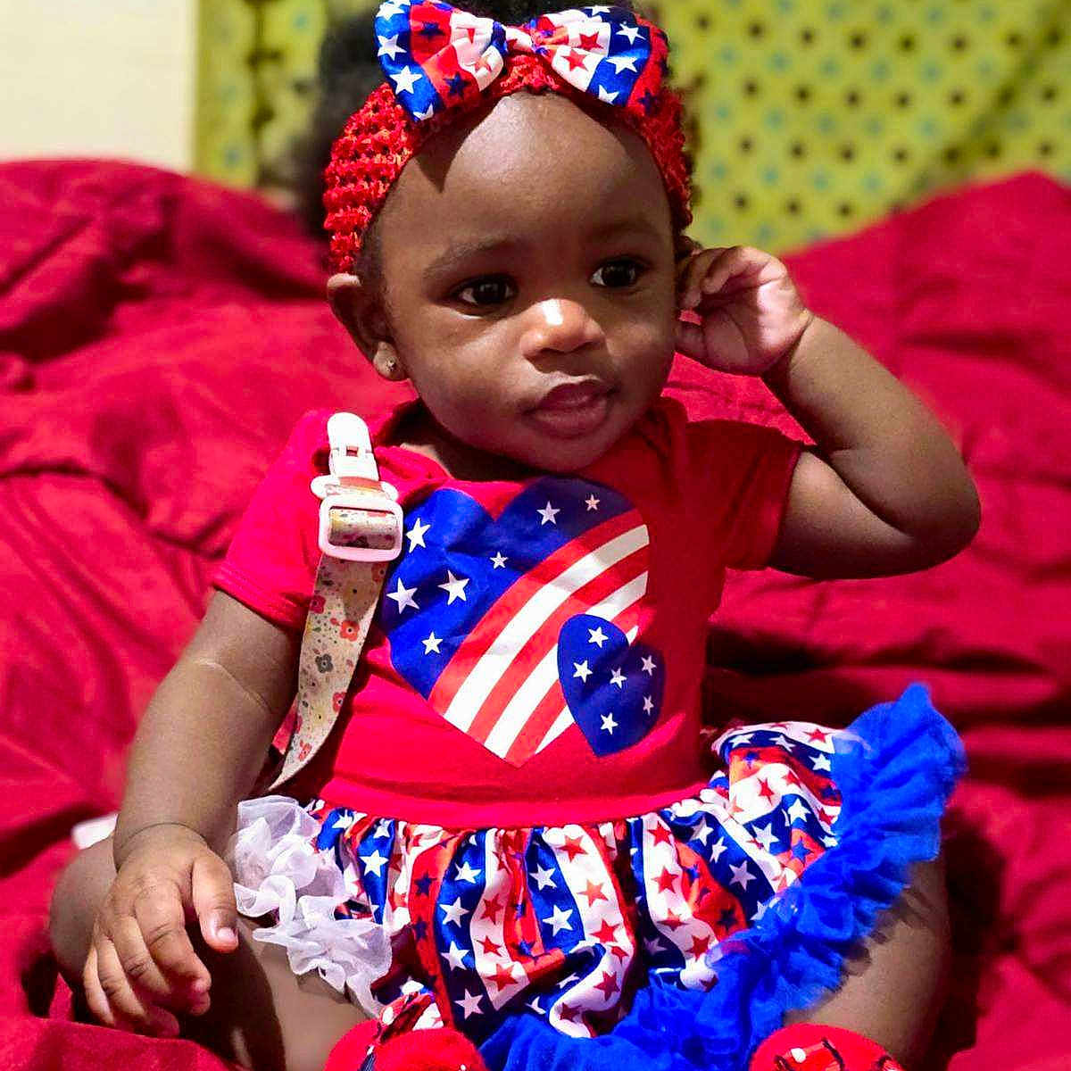 Kashlinn joined the competition — help win amazing prizes! accessories, americanflag, baby, bed, bodypart, clothing, couch, cushion, dress, face, finger, flag, furniture, hand, head, homedecor, person, photography, portrait, sitting