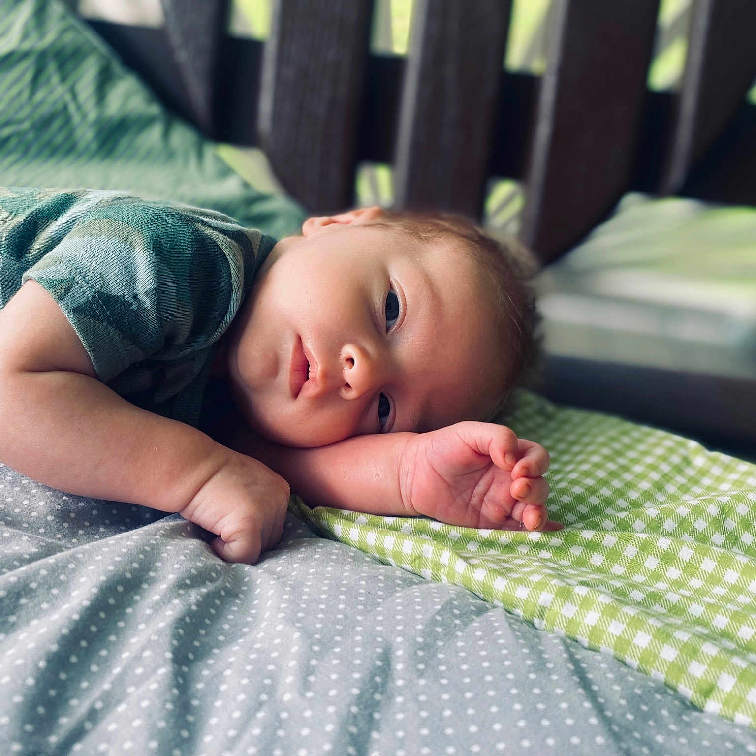 Jackson joined the competition — help win amazing prizes! baby, baby_toddler_clothing, bedding, child, comfort, eye, eyebrow, flash_photography, flooring, grass, head, iris, linens, pattern, room, sitting, skin, textile, toddler, wood