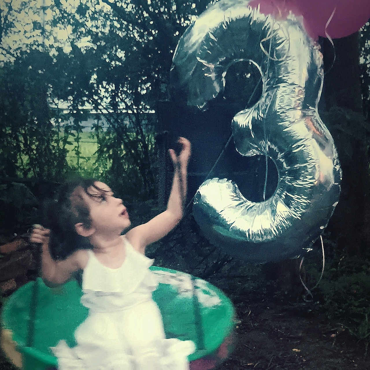 Nova is registered to the contest to win money with this photo: balloon, child, clothing, dress, face, female, girl, grass, head, land, nature, outdoors, person, photography, plant, portrait, text, tree, vegetation, woodland