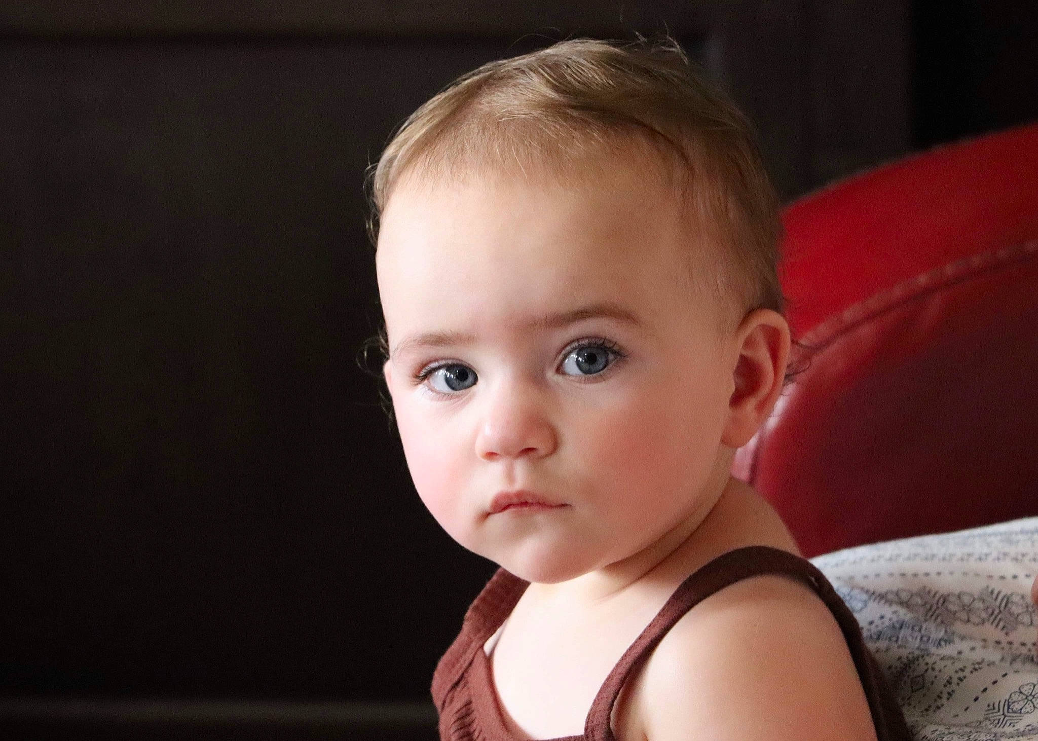 Aleia is registered to the contest to win money with this photo: baby, baby_toddler_clothing, cheek, child, comfort, eyebrow, eyelash, face, flash_photography, flooring, fun, happy, iris, lip, nose, person, portrait_photography, room, sitting, smile