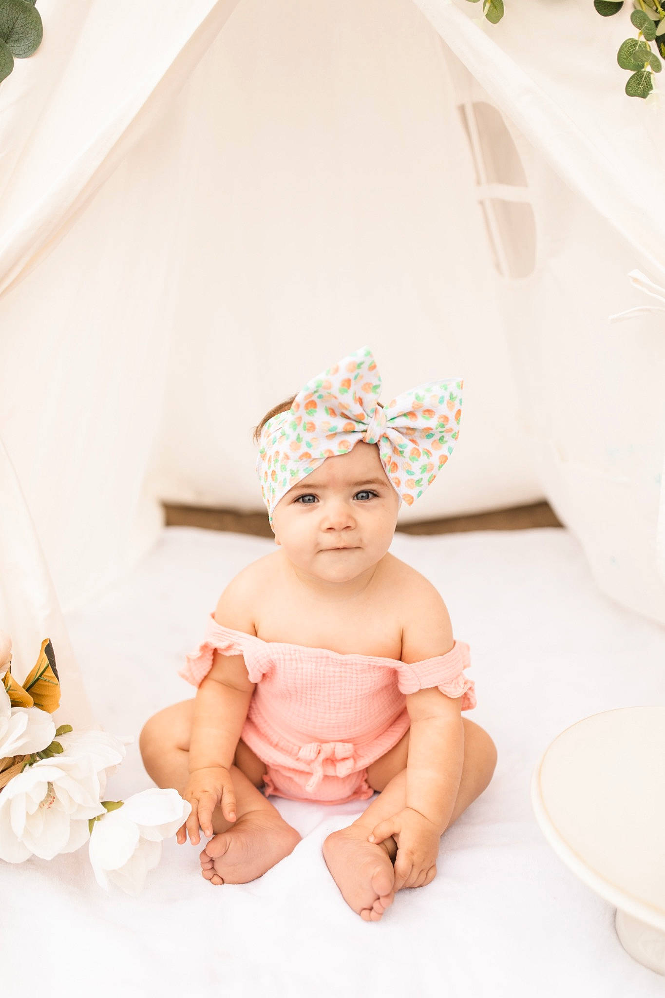 Aleia is registered to the contest to win money with this photo: baby, baby_toddler_clothing, bridal_accessory, cap, child, event, fashion_accessory, flash_photography, flooring, fun, hair_accessory, happy, headband, headpiece, headwear, jewellery, peach, person, room, sitting