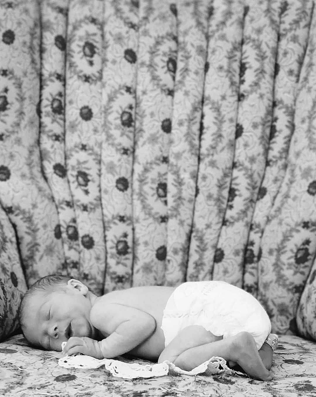 Ethan is registered to the contest to win money with this photo: adaptation, baby, black_and_white, child, curtain, flash_photography, flooring, grass, happy, human_body, human_leg, monochrome, monochrome_photography, people_in_nature, person, sitting, still_life_photography, style, toddler, wall