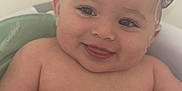 Ezme is registered to the contest to win money with this photo: baby, child, smiling, tongue_out, bathtub, soap, wet_hair, skin, cute, happy, infant, water, playful, bath_time, person, closeup, head, face, expression, fun