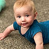baby, child, infant, crawling, blue_shirt, carpet, face, eyes, skin, hair, expression, close_up, indoors, cute, young, person, portrait, smiling, happy, playful