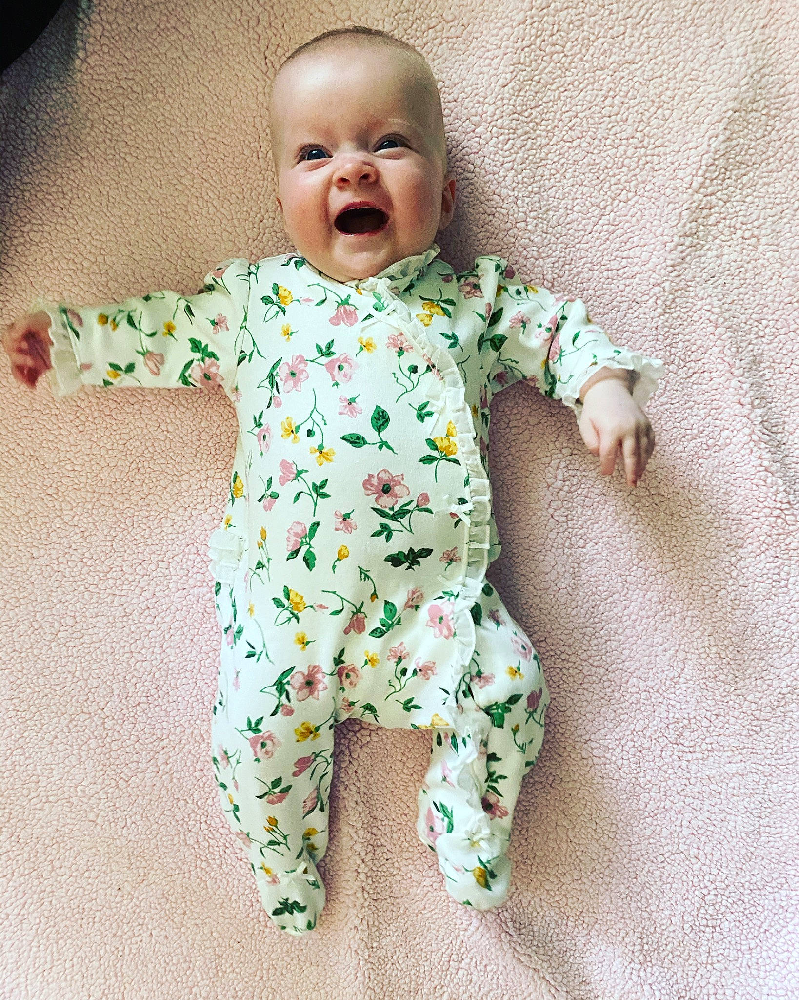 Nadia is registered to the contest to win money with this photo: baby, baby_products, baby_toddler_clothing, camouflage, cheek, child, facial_expression, laugh, nightwear, pattern, person, sleeve, toddler