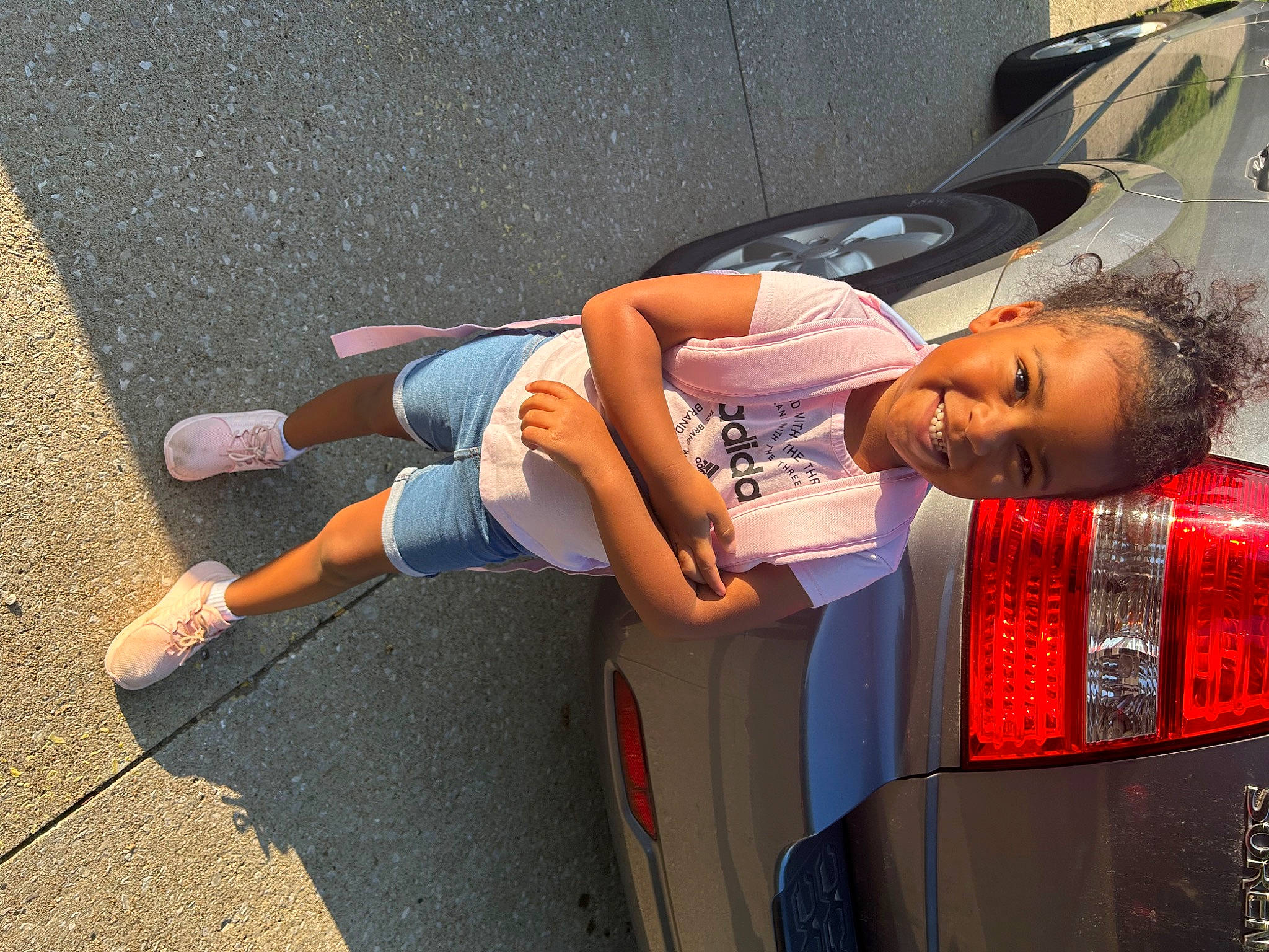 Jada joined the competition — help win amazing prizes! asphalt, auto_part, automotive_design, automotive_exterior, automotive_lighting, automotive_tail_brake_light, automotive_tire, automotive_wheel_system, bumper, car, family_car, human_leg, joy, mode_of_transport, motor_vehicle, person, personal_luxury_car, road_surface, travel, trunk