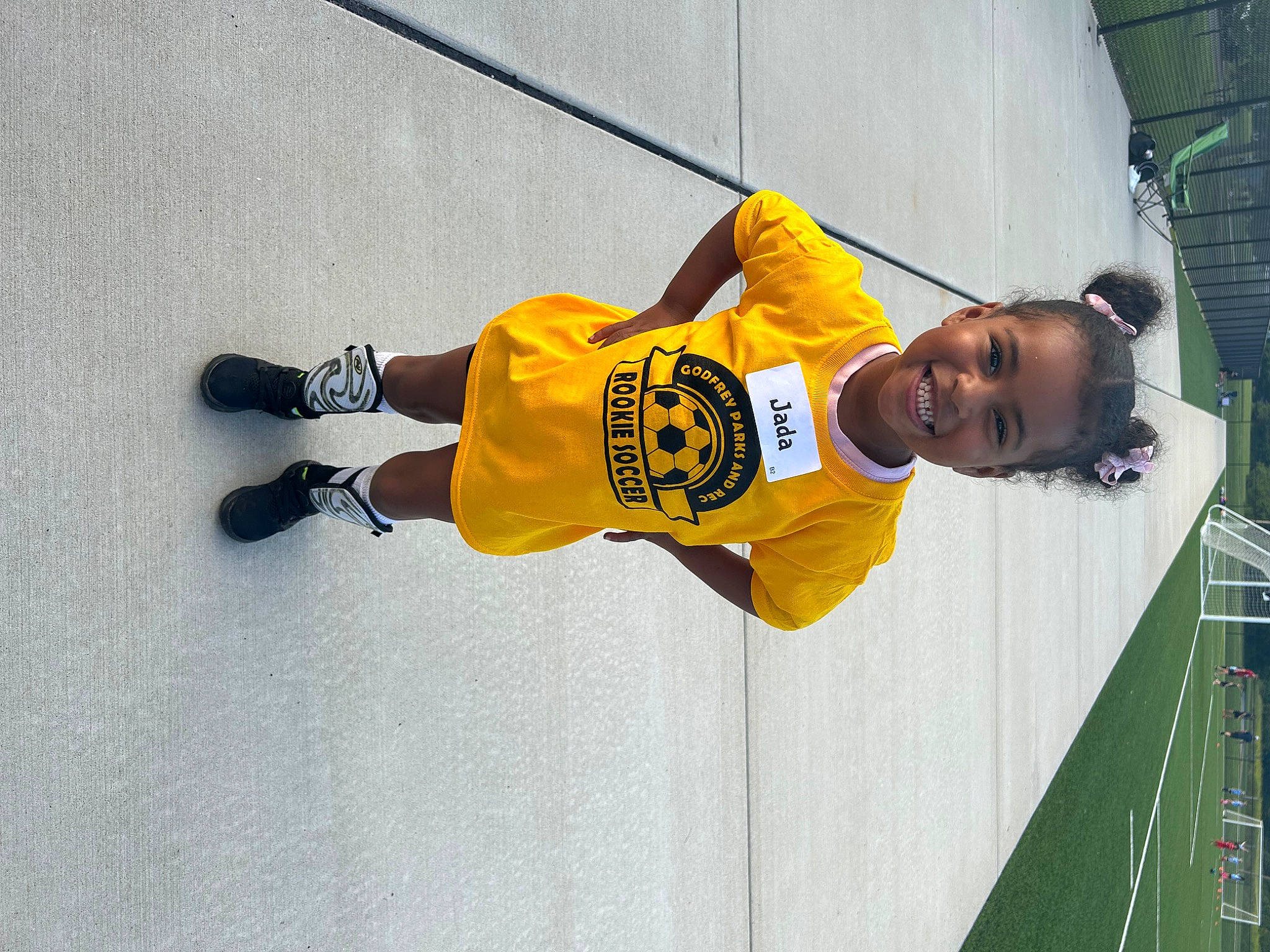 Jada joined the competition — help win amazing prizes! carmine, jersey, joy, outdoor_shoe, person, player, recreation, smile, sports, sports_jersey, sports_uniform, sportswear, sweatpant, t_shirt, toddler, uniform, walking_shoe