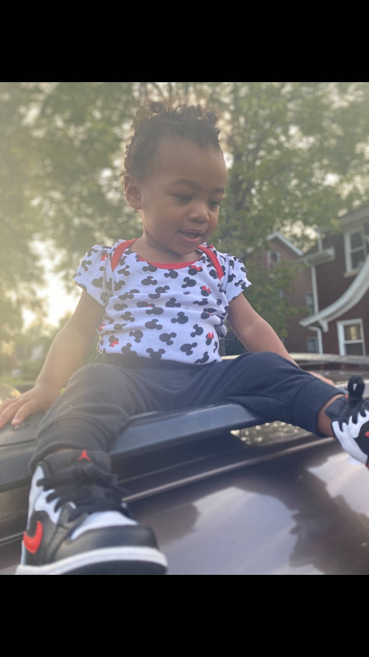 Amirah joined the competition — help win amazing prizes! automotive_exterior, bumper, cool, electric_blue, flash_photography, fun, grass, happy, knee, leisure, motor_vehicle, outdoor_recreation, person, recreation, rolling, shorts, sleeve, t_shirt, tints_and_shades, toddler