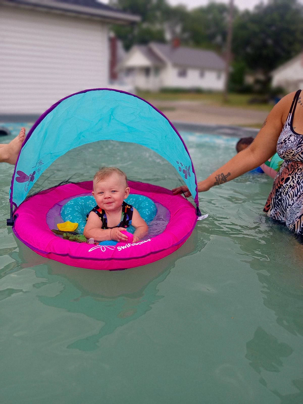 Remington joined the competition — help win amazing prizes! baby_toddler_clothing, bathing, boats_and_boating_equipment_and_supplies, child, fun, happy, inflatable, joy, lake, leisure, magenta, outdoor_recreation, person, personal_protective_equipment, pink, play, recreation, sky, toddler, tree