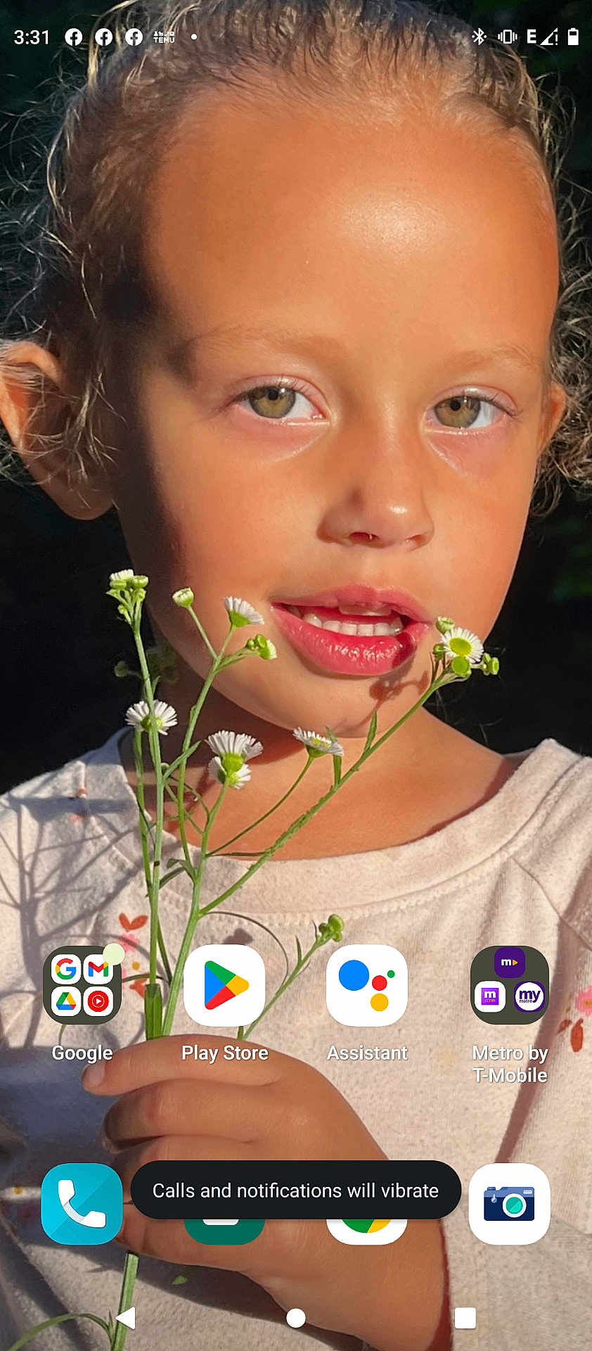 Camryn is registered to the contest to win money with this photo: bodypart, child, cosmetics, daisy, face, female, finger, flower, girl, hand, happy, head, lipstick, mouth, person, photography, plant, portrait, smelling, smile