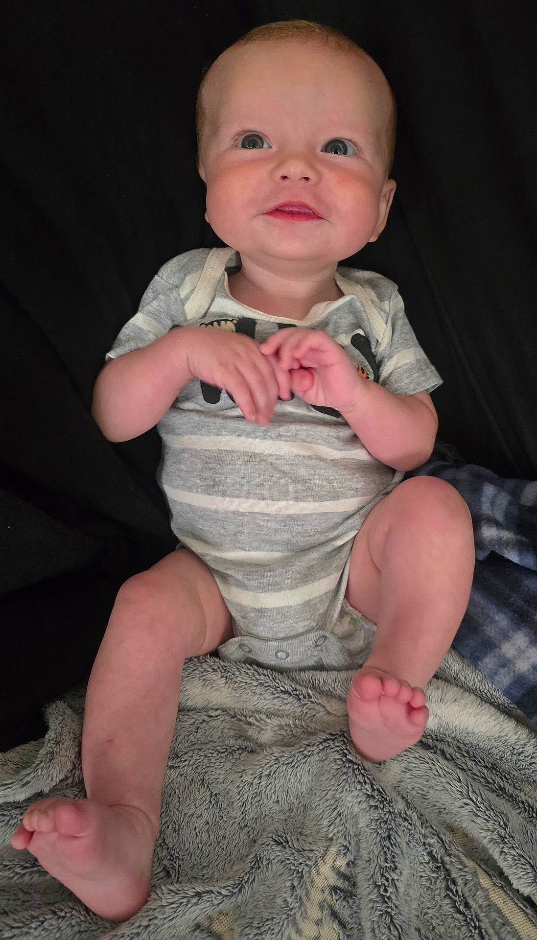 Arthur is registered to the contest to win money with this photo: baby, barefoot, bodypart, clothing, diaper, dress, face, finger, hand, happy, head, jeans, newborn, pants, person, photography, portrait, shorts, sitting, smile