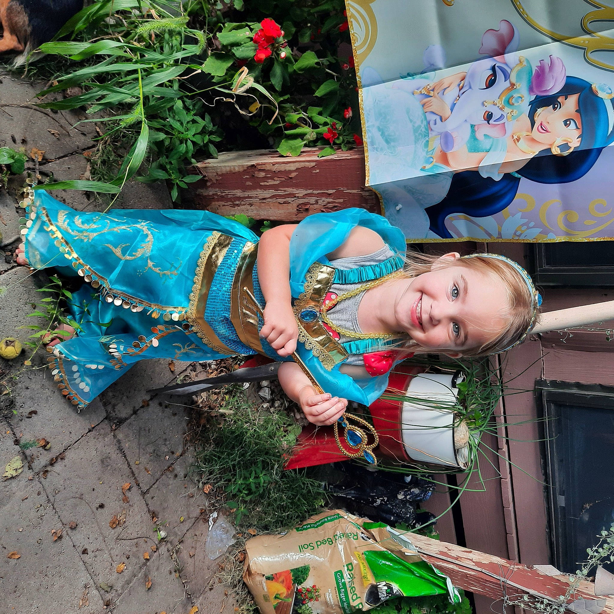 Jazzlyn is registered to the contest to win money with this photo: child, costume, electric_blue, event, fun, grass, green, happy, joy, leisure, pattern, person, plant, sandal, sitting, smile, toddler, tree, visual_arts