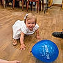 Paola a rejoint le concours — aidez-le/la à gagner de superbes lots ! toddler, child, white_dress, hair_bow, crawling, smiling, balloon, birthday, wooden_floor, indoor, chairs, people, shoes, sandals, happy, celebration, party, floor, person, cute