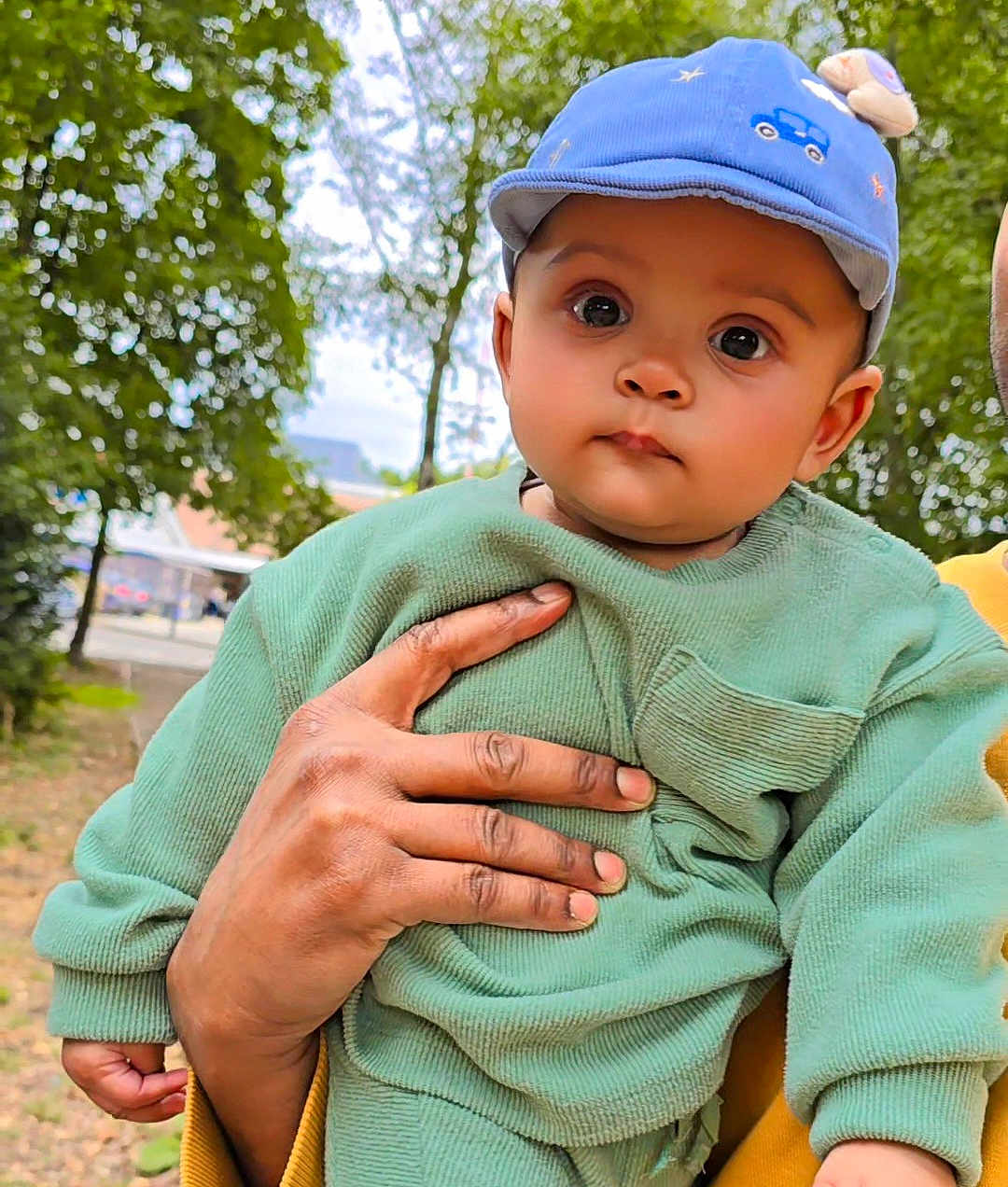 Aadvik Kushwaha is registered to the contest to win money with this photo: baby, child, person, hand, cap, clothing, outdoor, nature, trees, greenery, cute, portrait, young, face, skin, expression, holding, sleeve, background, daylight