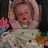 baby, sleeping, blanket, car_seat, headband, toy, pacifier, infant, cozy, child, pink, soft, cute, peaceful, indoors, polka_dot, face, apparel, comfort, resting