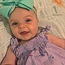 Paislee is registered to the contest to win money with this photo: baby, child, smiling, bow, headband, purple_dress, blanket, face, infant, cute, happy, portrait, one_month, lying_down, closeup, skin, eyes, person, toddler, clothing