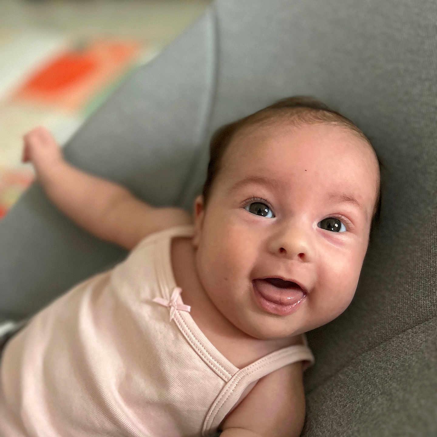 Thaïs a rejoint le concours — aidez-le/la à gagner de superbes lots ! baby, child, closeup, clothing, cute, expression, face, gray, happy, indoor, infant, person, pink, portrait, seat, skin, smiling, soft, tank_top, young