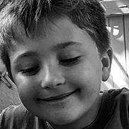 Timéo participe au concours pour gagner de l'argent avec cette photo : child, boy, smile, face, portrait, black_and_white, hair, closeup, expression, casual, young, happy, indoors, tshirt, light, shadow, texture, skin, person, head