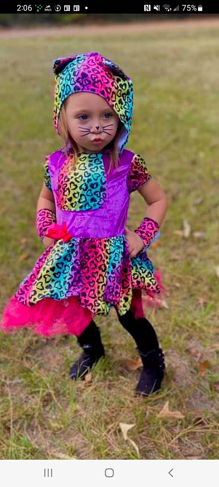 Aleigha is registered to the contest to win money with this photo: baby, baby_toddler_clothing, child, dress, electric_blue, fashion_accessory, fun, grass, grassland, happy, headwear, magenta, pattern, people_in_nature, person, pink, plant, purple, sleeve, smile