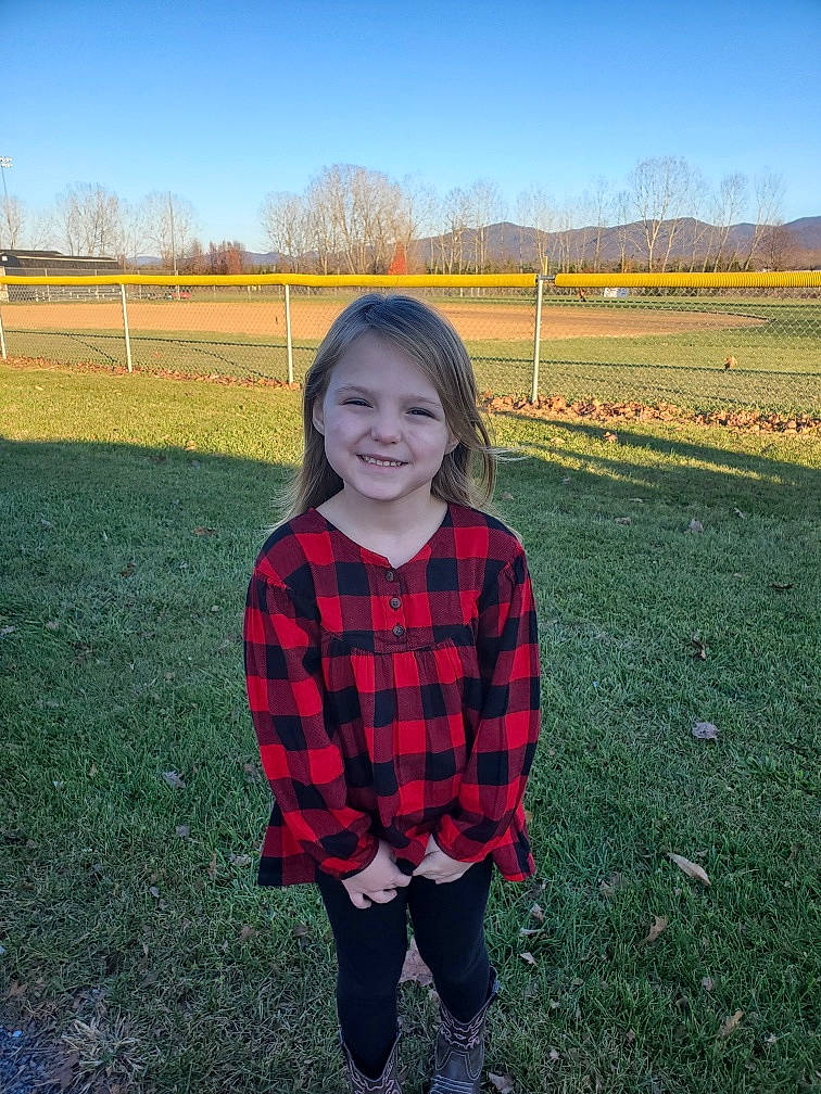 Faith Nicole is registered to the contest to win money with this photo: child, design, farm, fun, grass, grassland, happy, joy, leaf, pattern, person, plaid, plant, sky, smile, standing, tartan, textile, toddler, tree