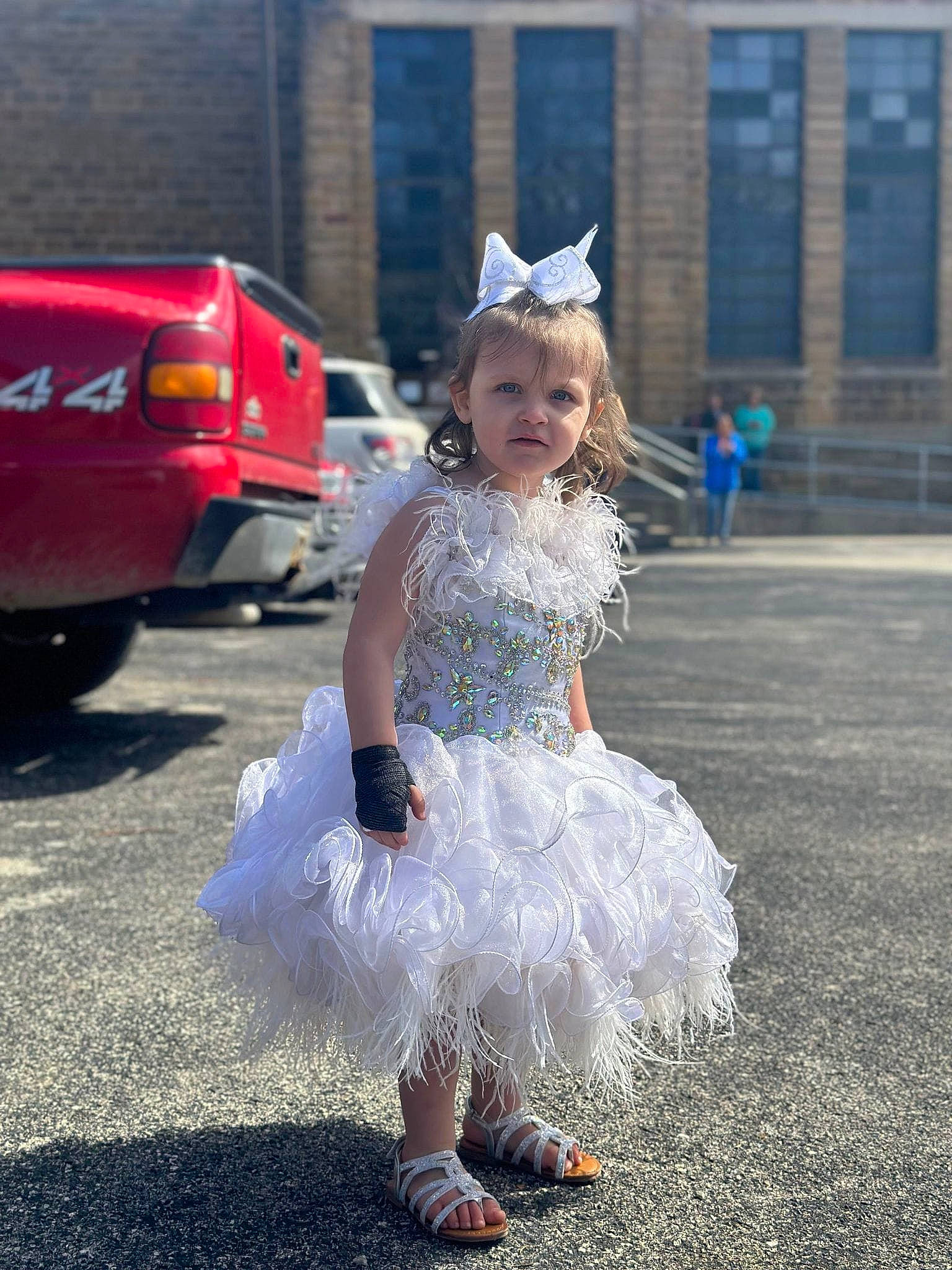 Jaycelynn is registered to the contest to win money with this photo: asphalt, automotive_design, automotive_exterior, automotive_lighting, car, child, dress, electric_blue, event, fashion, fun, happy, motor_vehicle, person, pink, public_space, road, standing, street, toddler