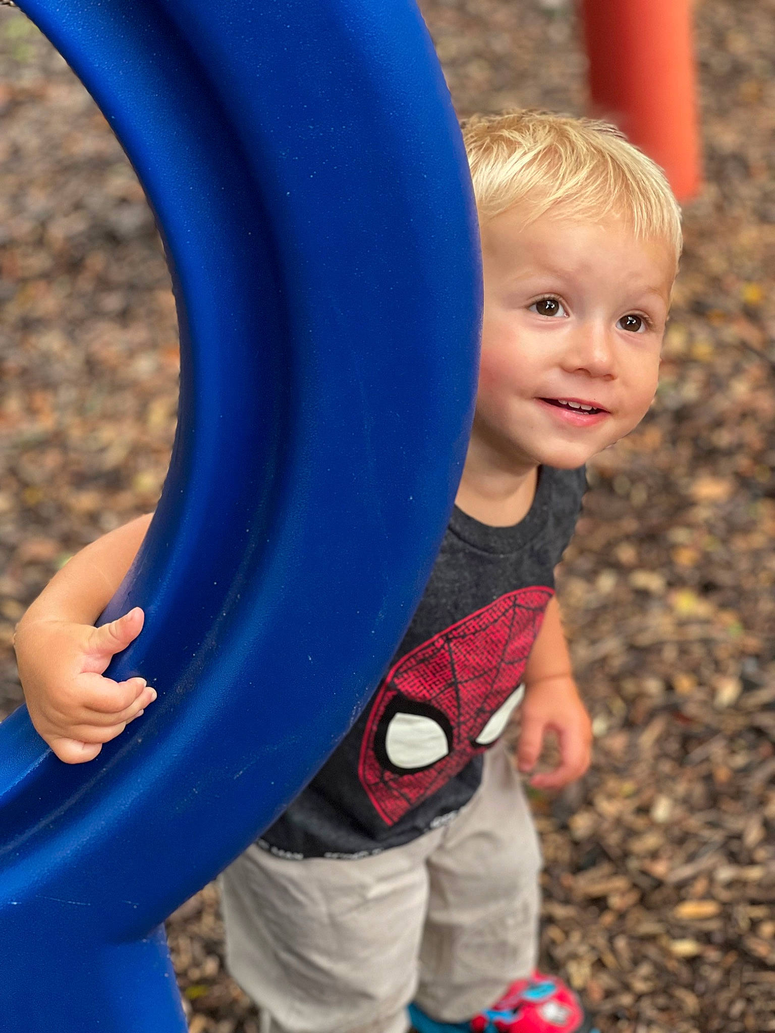 Bryson is registered to the contest to win money with this photo: arm, blue, child, chute, electric_blue, facial_expression, fun, happy, human_body, joy, leisure, mammal, organ, outdoor_play_equipment, people, person, photograph, public_space, recreation, red