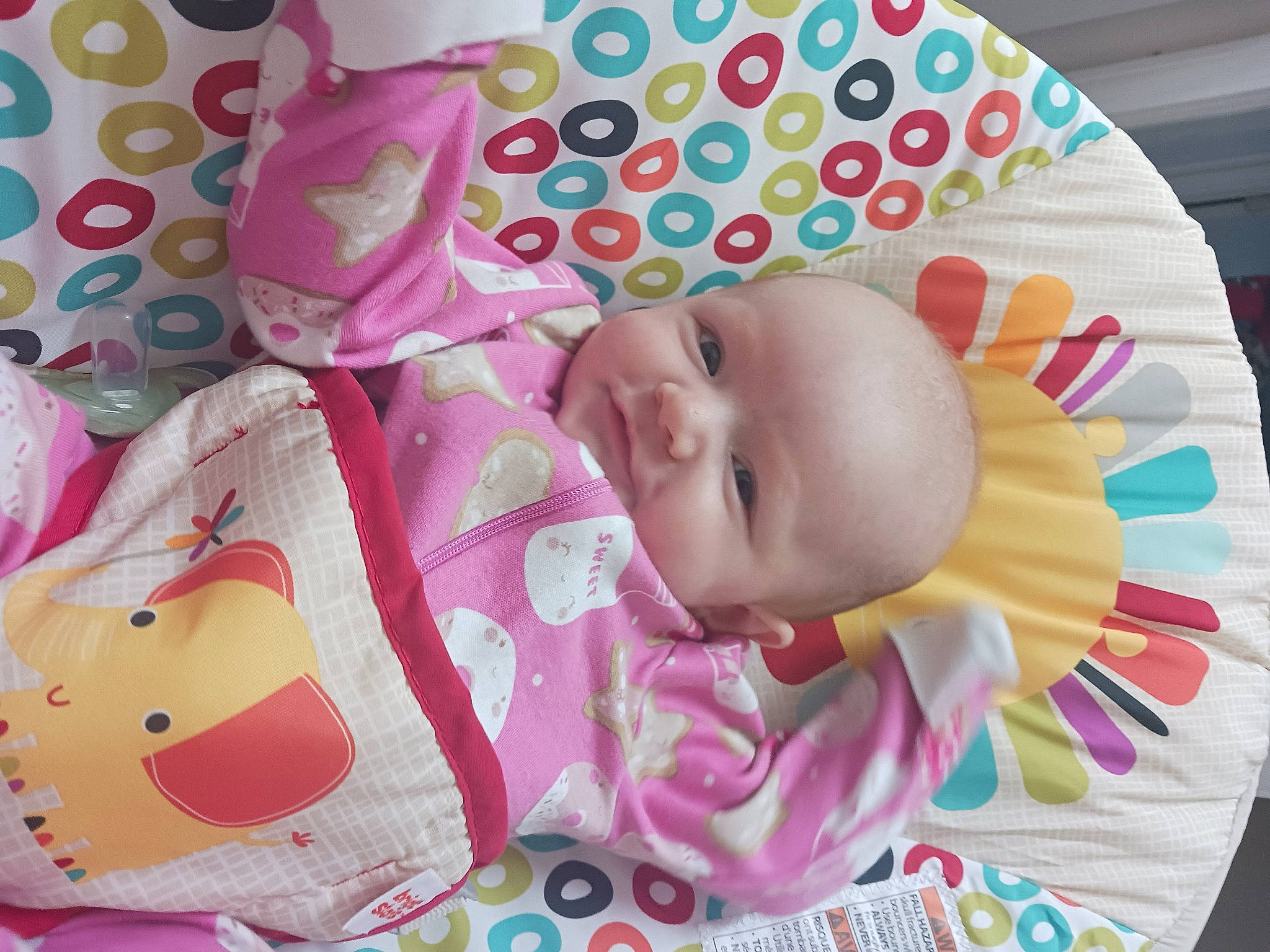 Grace is registered to the contest to win money with this photo: baby, baby_products, baby_toddler_clothing, carmine, cheek, child, happy, linens, magenta, pattern, person, pink, product, smile, textile, toddler