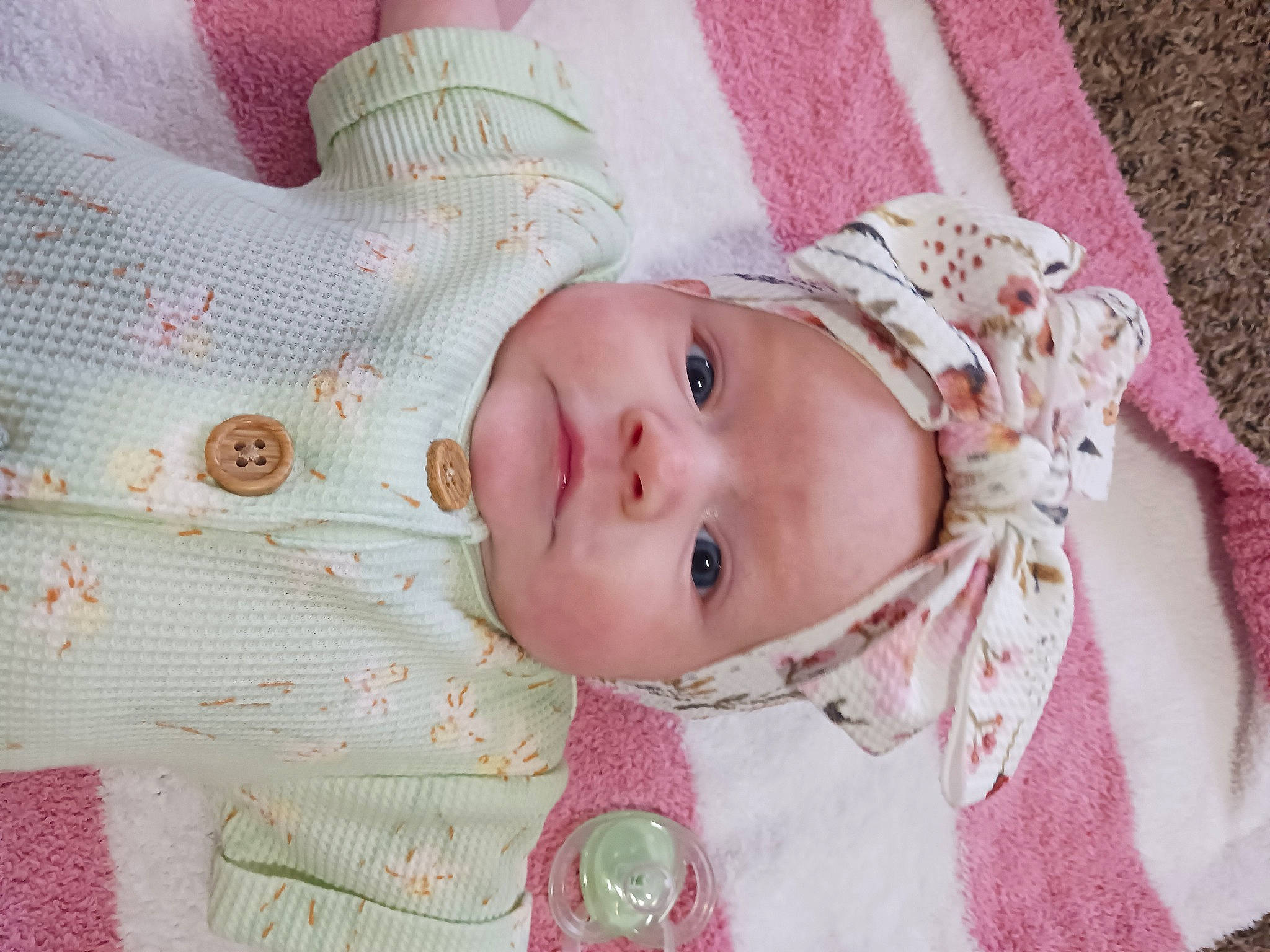 Grace is registered to the contest to win money with this photo: baby, baby_toddler_clothing, cheek, child, clothing, eye, eyebrow, eyelash, happy, head, headwear, iris, linens, lip, pattern, person, pink, skin, sleeve, smile
