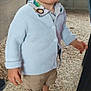 Gabriel participe au concours pour gagner de l'argent avec cette photo : toddler, child, blue_eyes, sweater, shorts, sneakers, indoor, gravel_floor, curious, standing, casual_clothing, person, young_child, light_blue, animal_print, footwear, serious_expression, cute, portrait, fashion