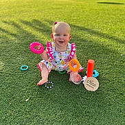 Savannah joined the competition — help win amazing prizes! baby, child, grass, toy, colorful, smiling, outdoor, nine_months, milestone, happy, sitting, playful, sunny, daylight, cute, clothing, rings, park, infant, nature