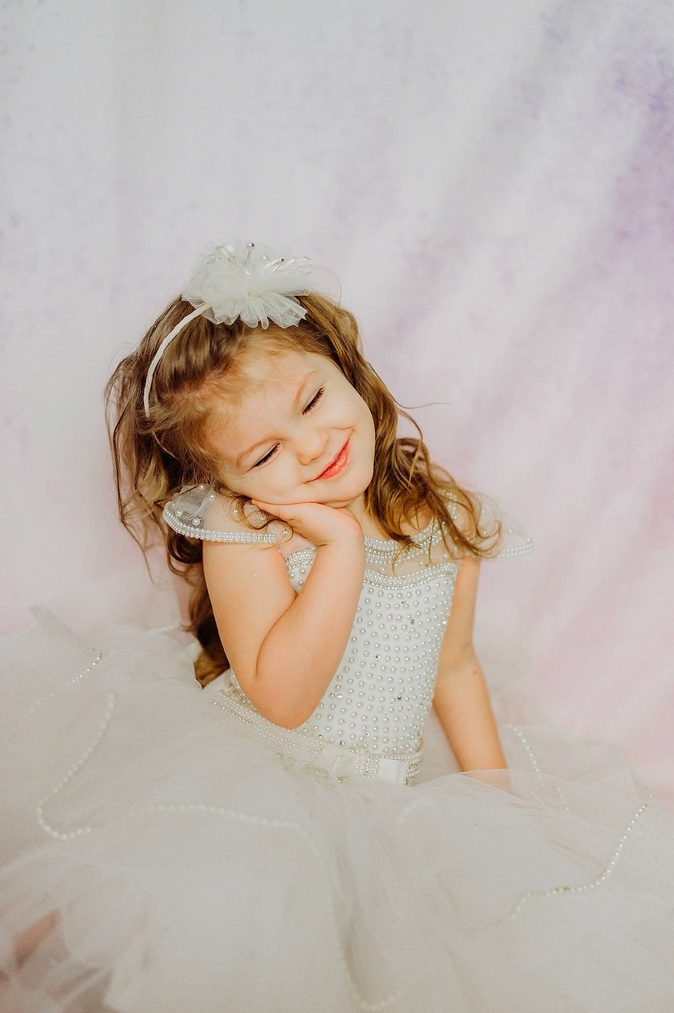 Dalia is registered to the contest to win money with this photo: beauty, blond, bridal_accessory, child, child_model, dress, eye, hair, hair_accessory, hairstyle, hand, headgear, headpiece, joy, long_hair, person, photograph, photography, pink, skin