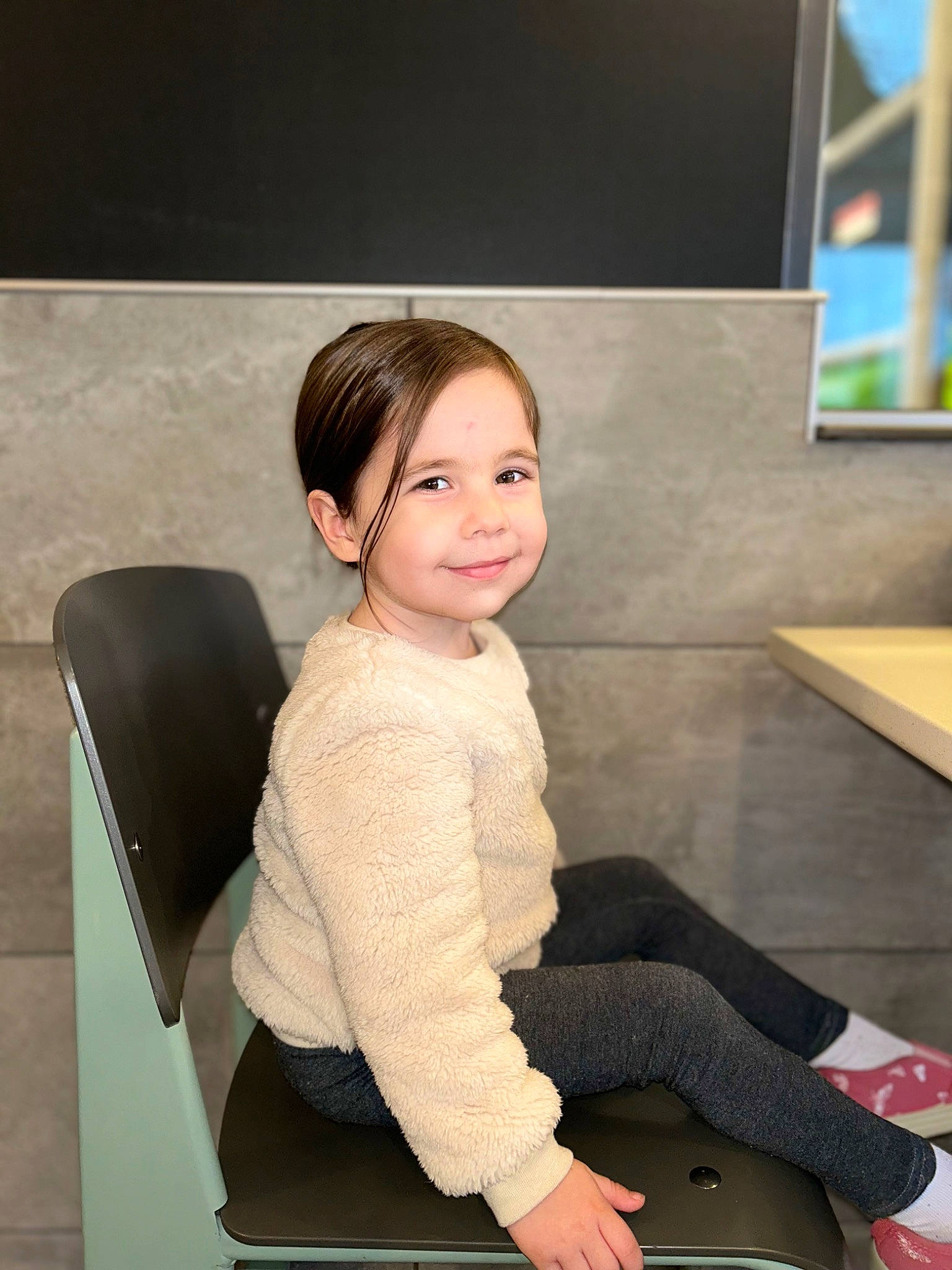 Helen Marie is registered to the contest to win money with this photo: chair, comfort, elbow, flash_photography, flooring, formal_wear, furniture, happy, human_leg, joint, joy, knee, lap, leisure, person, sitting, sleeve, smile, standing, table