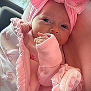 Blayne joined the competition — help win amazing prizes! baby, infant, pink, blanket, headband, bow, clothing, newborn, cute, portrait, face, hand, soft, wrapped, cozy, indoors, child, sleepwear, newborn_clothing, resting