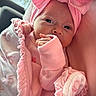 baby, infant, pink, blanket, headband, bow, clothing, newborn, cute, portrait, face, hand, soft, wrapped, cozy, indoors, child, sleepwear, newborn_clothing, resting