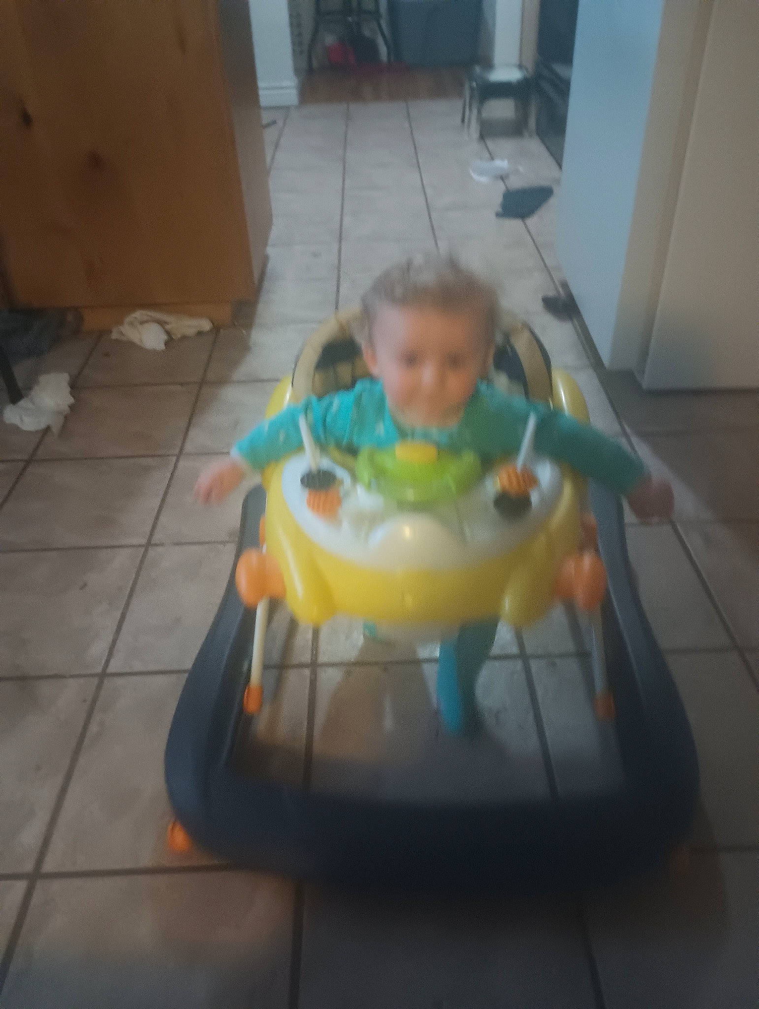 Hunter is registered to the contest to win money with this photo: baby, baby_products, baby_toddler_clothing, baby_toys, bib, chair, child, flooring, food, fun, hardwood, person, plastic, play, room, sitting, table, tableware, toddler