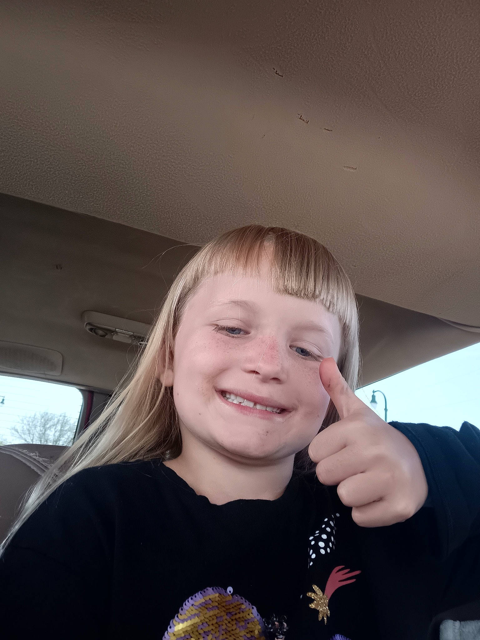 Lakayla joined the competition — help win amazing prizes! bangs, brown_hair, child, cool, finger, flash_photography, fun, gesture, hand, happy, iris, joy, laugh, nose, person, portrait_photography, sleeve, smile, t_shirt, toddler