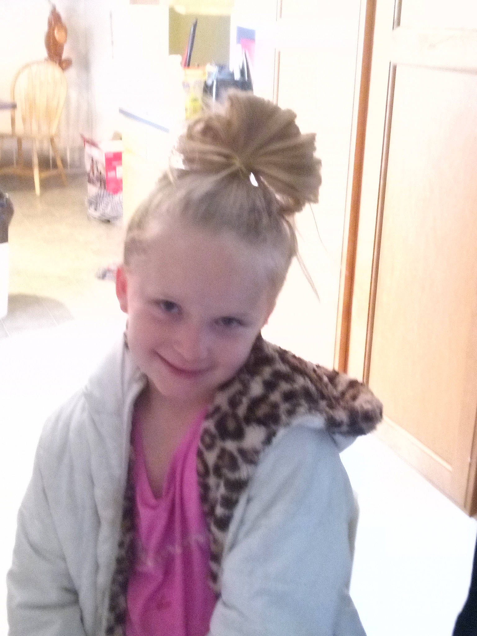 Lakayla is registered to the contest to win money with this photo: blond, bun, chair, child, door, ear, eyebrow, eyelash, fun, hair, hair_tie, hairstyle, happy, joy, neck, person, shoulder, sitting, skin, sleeve