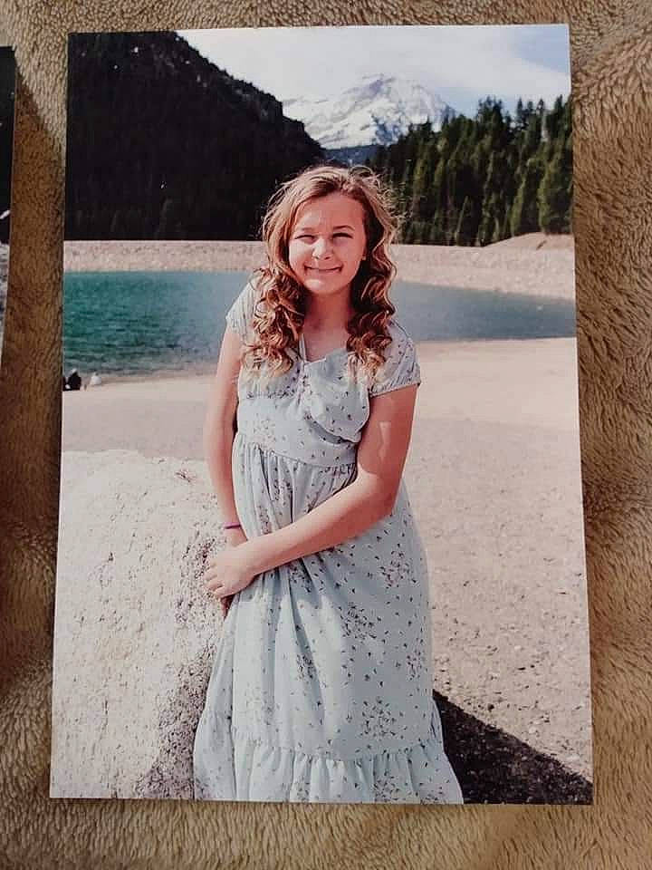 Makayla is registered to the contest to win money with this photo: bridal_party_dress, day_dress, dress, fashion, fashion_design, flash_photography, formal_wear, gown, happy, joy, landscape, mountain, one_piece_garment, person, sky, sleeve, smile, textile, travel, tree