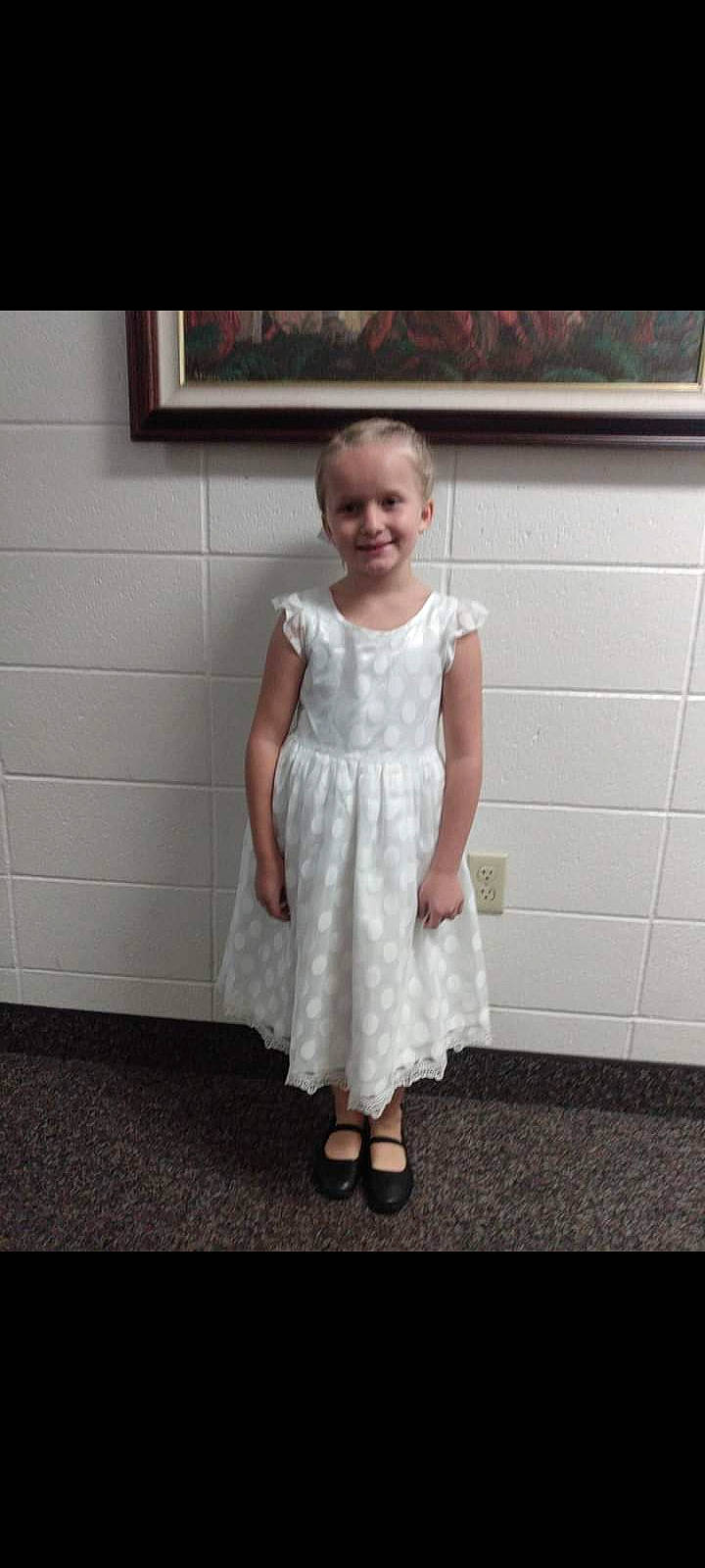 Lakayla is registered to the contest to win money with this photo: child, day_dress, dress, elbow, embellishment, fashion_design, floor, flooring, formal_wear, happy, human_leg, joy, knee, neck, one_piece_garment, pattern, person, picture_frame, sleeve, smile