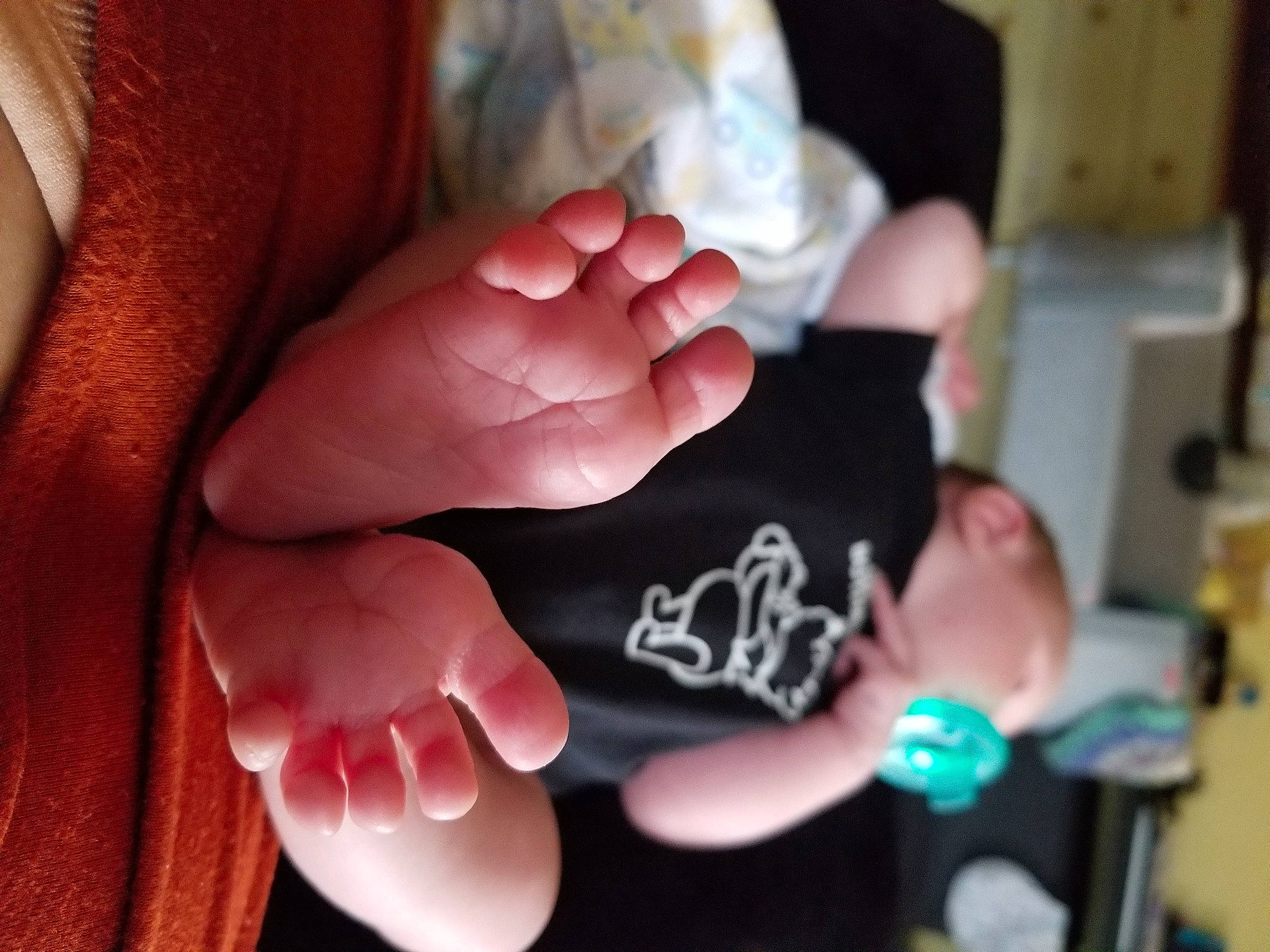 Amarah is registered to the contest to win money with this photo: baby, child, comfort_food, drinkware, event, finger, foot, fun, gesture, hand, musical_instrument, nail, person, sign_language, sitting, thumb, tree, wrist