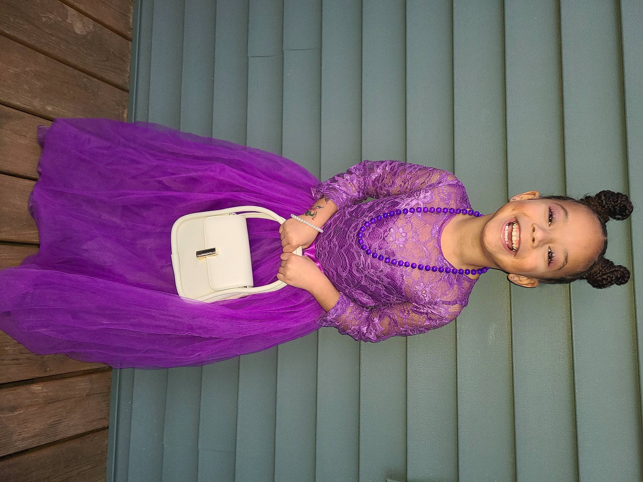 Malia is registered to the contest to win money with this photo: baby_toddler_clothing, child, comfort, electric_blue, fashion_accessory, happy, hat, joy, magenta, pattern, person, pink, purple, room, sleeve, smile, thigh, toddler, violet, wood