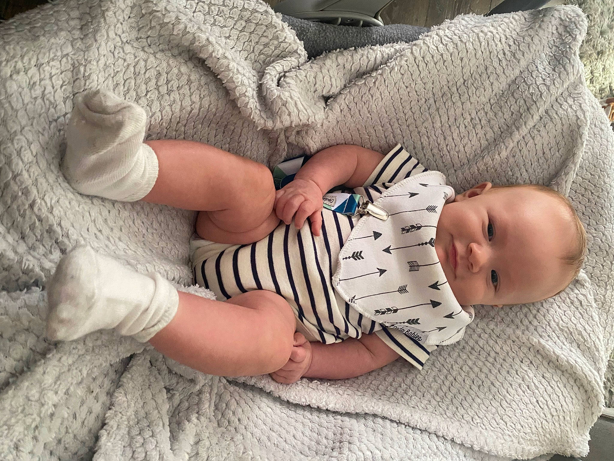 Evan is registered to the contest to win money with this photo: arm, baby, baby_sleeping, baby_toddler_clothing, child, comfort, finger, foot, hand, headgear, human_body, human_leg, joint, leg, nail, person, sitting, skin, sleeve, textile