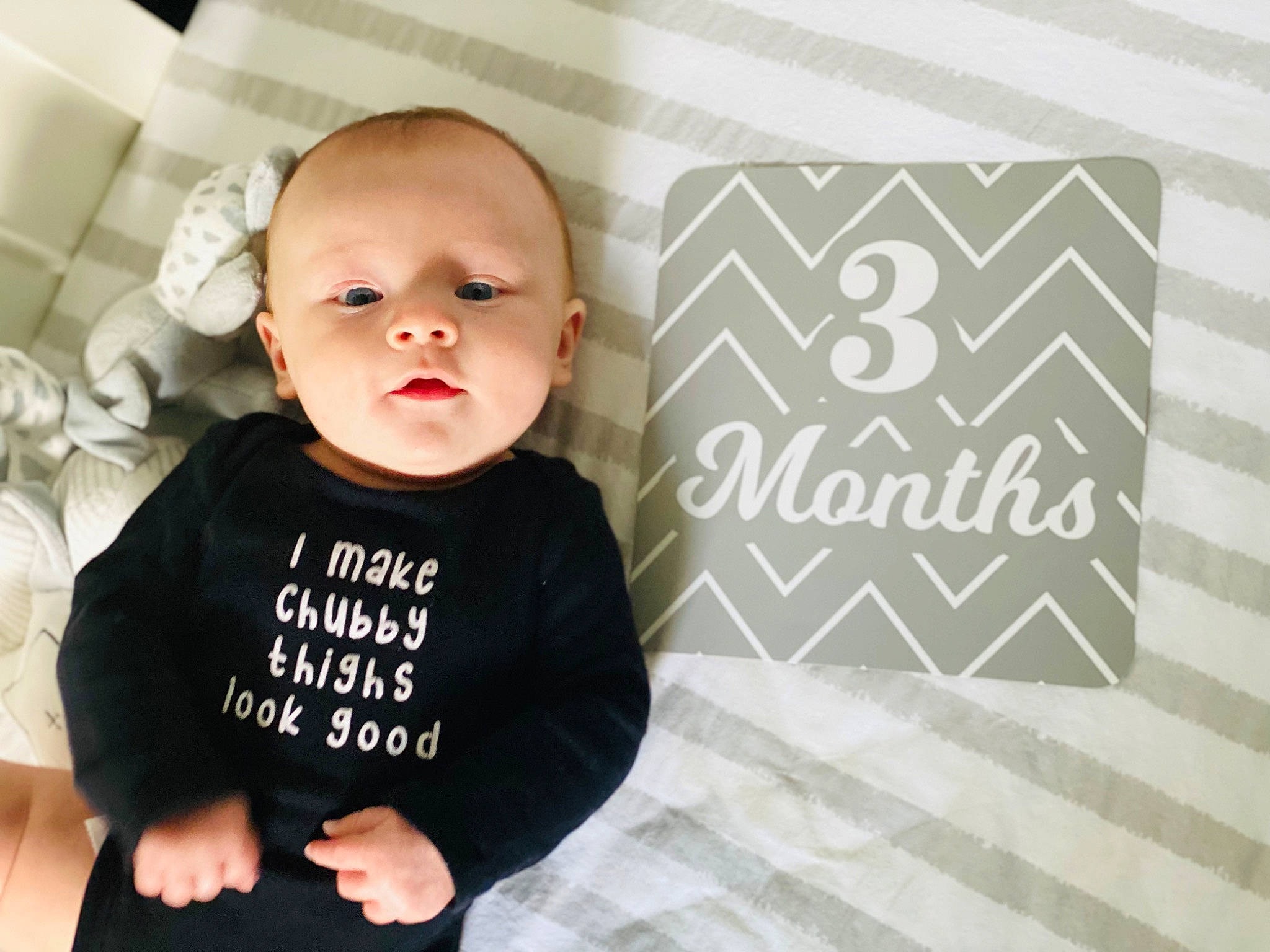 Evan is registered to the contest to win money with this photo: baby, baby_toddler_clothing, child, comfort, facial_expression, flash_photography, flooring, font, happy, long_sleeved_t_shirt, pattern, person, portrait_photography, room, sleeve, t_shirt, toddler, top